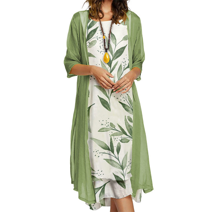 Moda femminile primavera/estate: completo due pezzi con abito midi floreale e giacca leggera chic.