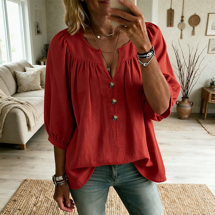 Blusa da donna alla moda, con scollo a V e maniche 3/4, un capo versatile per outfit eleganti e casual.