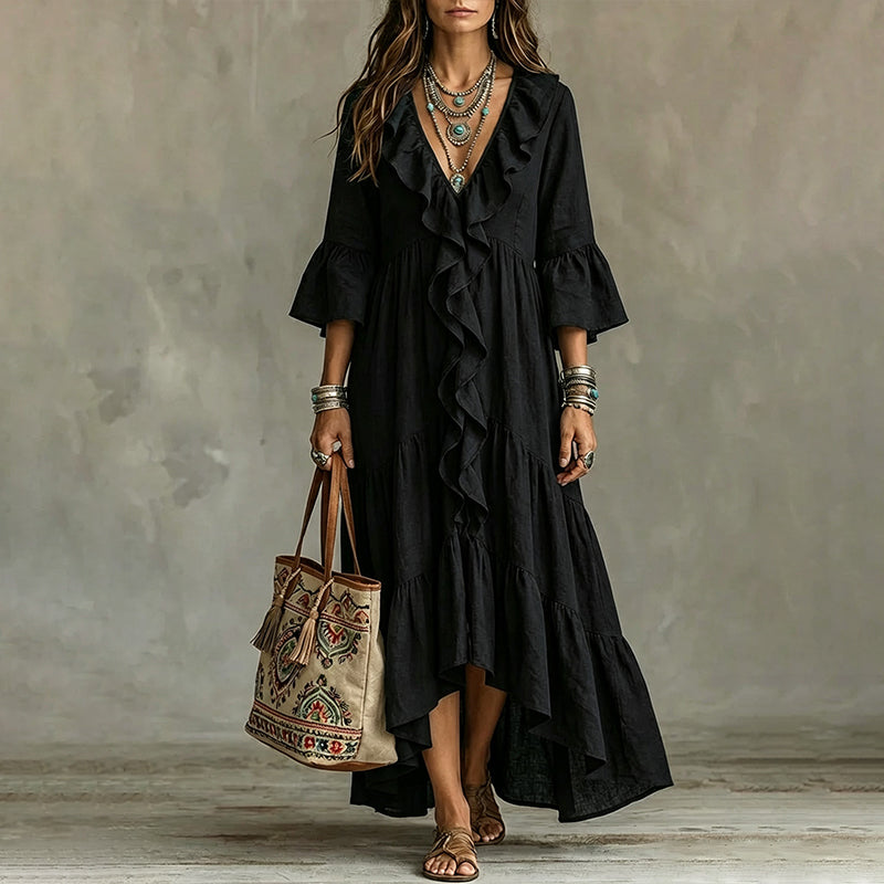 Abito midi donna bohemien con eleganti maniche a campana e tessuto leggero, moda primavera estate.