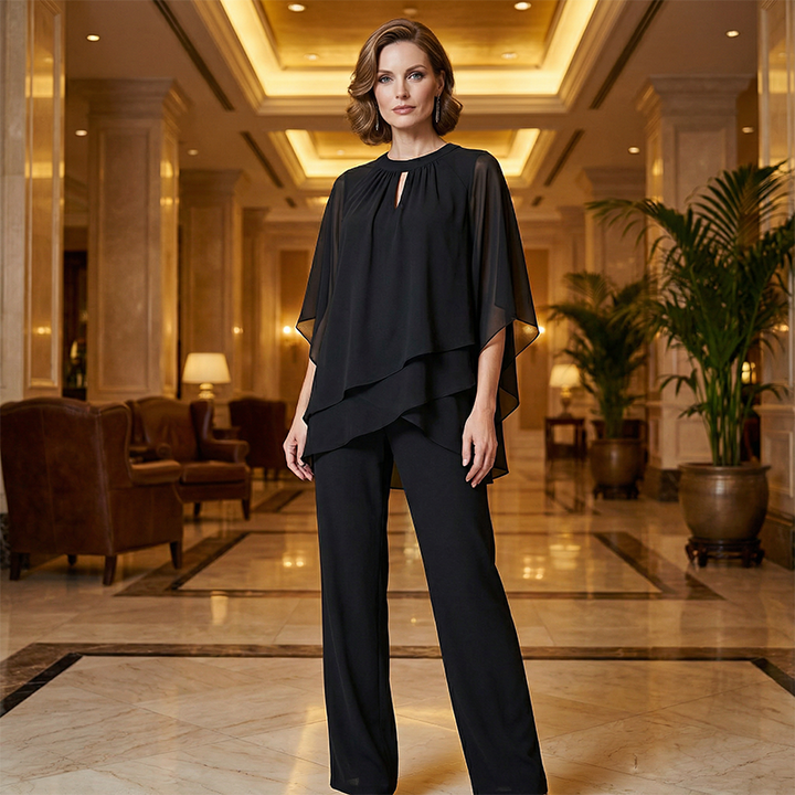 Completo sera donna elegante: blusa asimmetrica e pantaloni ampi. Perfetto per serate speciali e moda femminile.