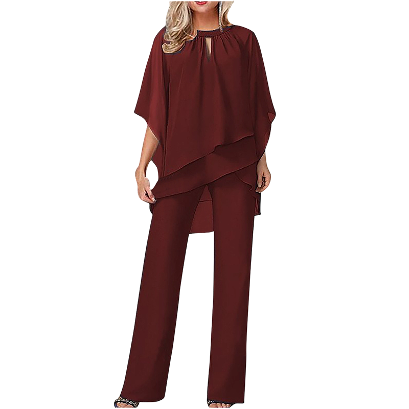 Blusa asimmetrica e pantaloni ampi: un completo donna chic per eventi speciali e serate eleganti.