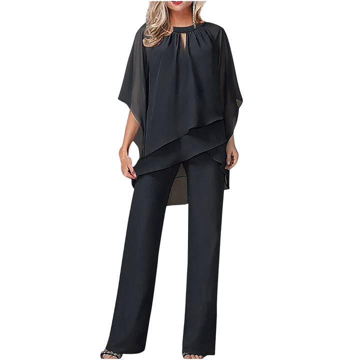 Completo donna elegante con blusa asimmetrica e pantaloni ampi. Perfetto per outfit cerimonia.