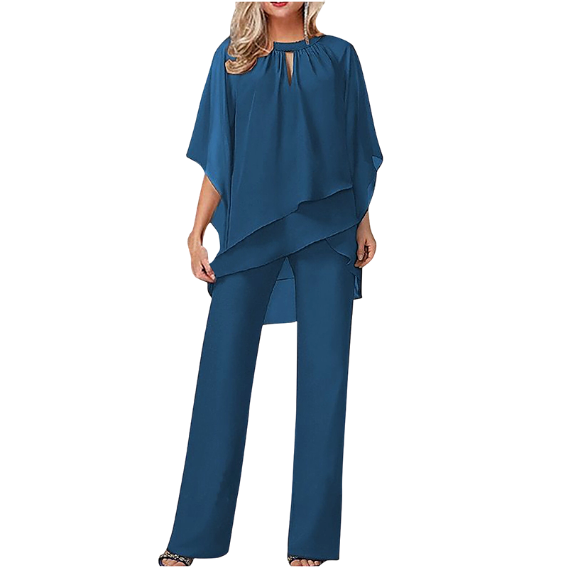 Abbigliamento elegante donna: completo asimmetrico con pantaloni ampi e vestibilità fluida per cerimonia.