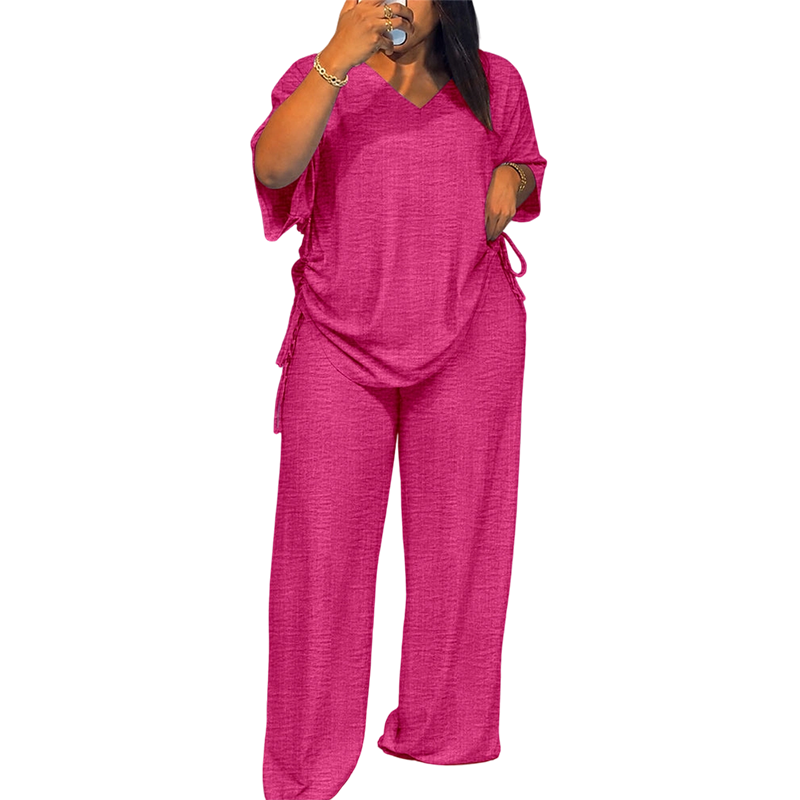 Abbigliamento donna versatile: completo due pezzi fluido con top e pantaloni larghi. Perfetto per moda casual.