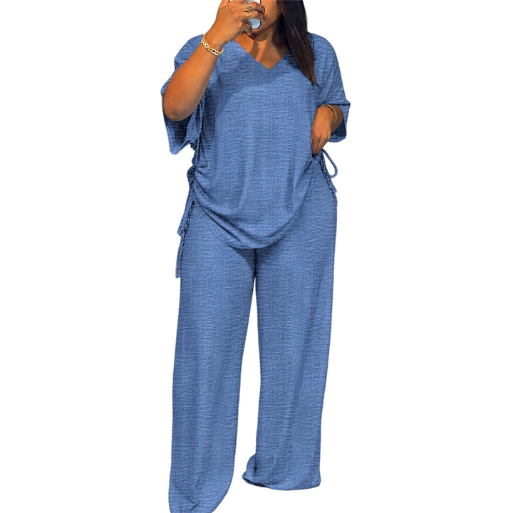 Completo donna due pezzi fluido con top regolabile e pantaloni larghi, ideale per un look estivo e moderno.