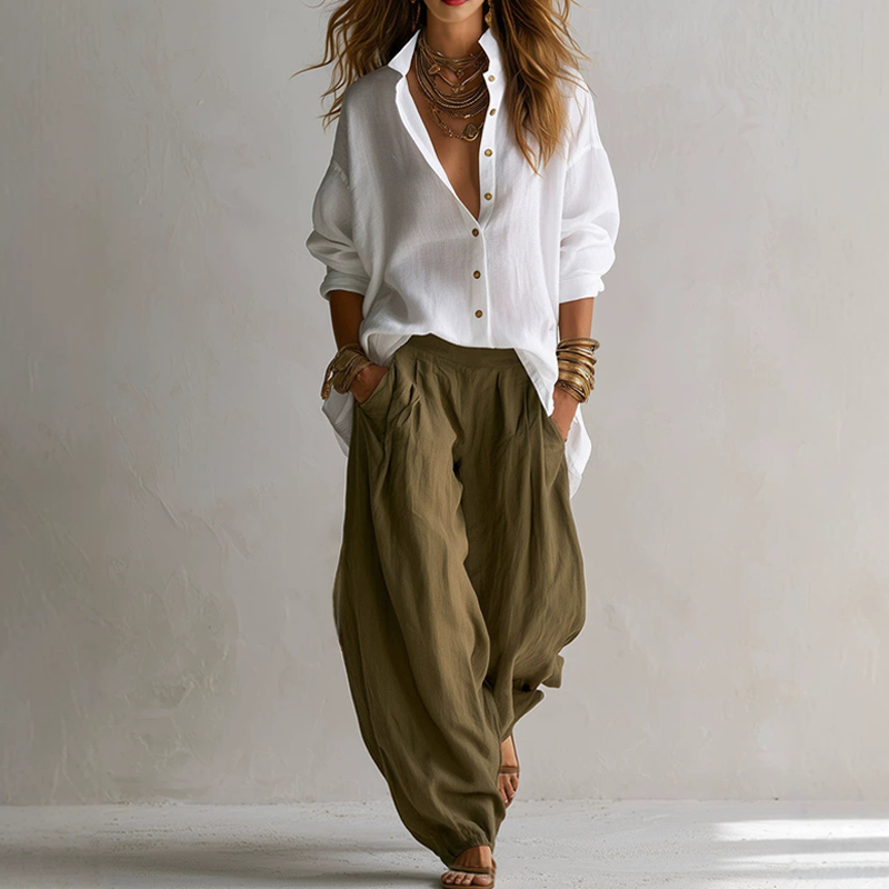 Completo donna elegante casual due pezzi: camicia ampia e pantaloni fluidi in poliestere. Outfit comodo e versatile.