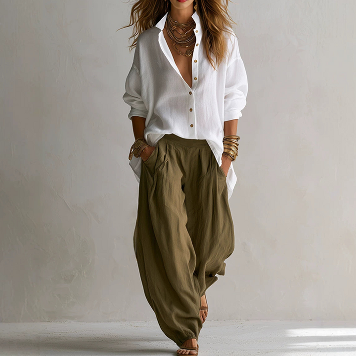 Completo donna elegante casual due pezzi: camicia ampia e pantaloni fluidi in poliestere. Outfit comodo e versatile.