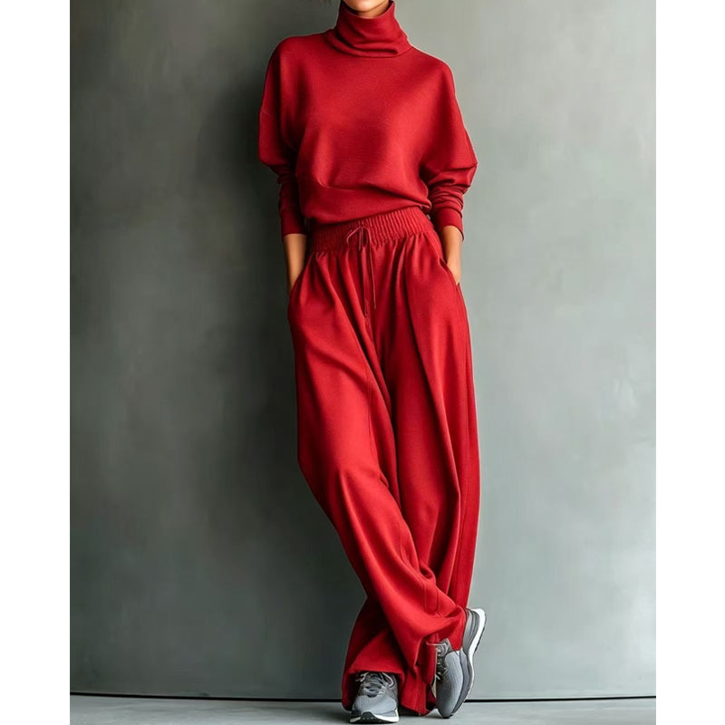 Completo femminile due pezzi: maglia collo alto e pantaloni ampi, un must-have per la moda attuale.