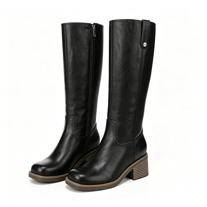 Stivali donna al ginocchio neri con tacco a zeppa, ideali per autunno/inverno. Eleganza e comfort per la moda donna.