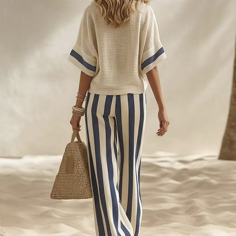 Completo estivo donna casual chic, pantaloni ampi a righe per comfort e stile vacanza.