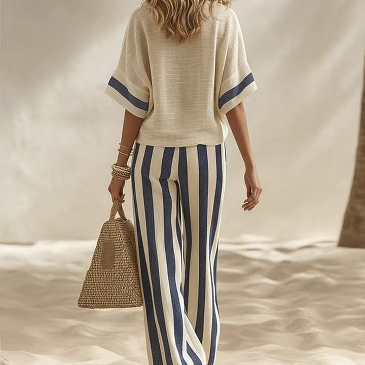Completo estivo donna casual chic, pantaloni ampi a righe per comfort e stile vacanza.