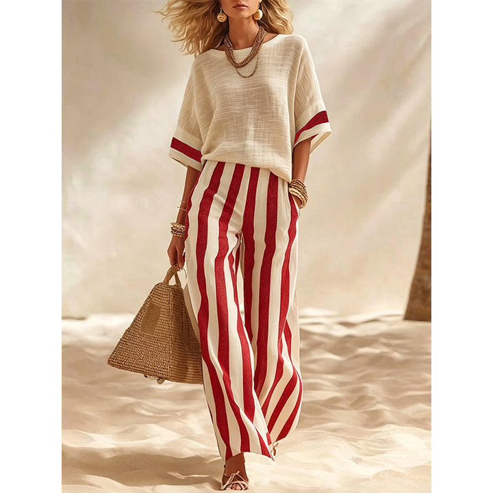Abbigliamento donna estivo per vacanze, completo elegante a righe con pantaloni fluidi.