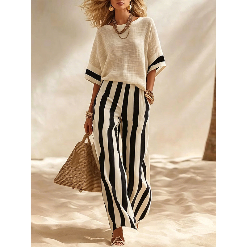 Completo estivo donna a righe eleganti, pantaloni larghi per un outfit moda.