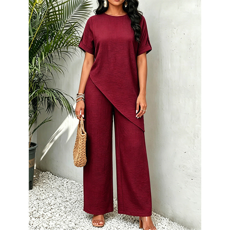Completo coordinato donna, top asimmetrico e pantaloni ampi, un capo di moda versatile per ogni occasione.