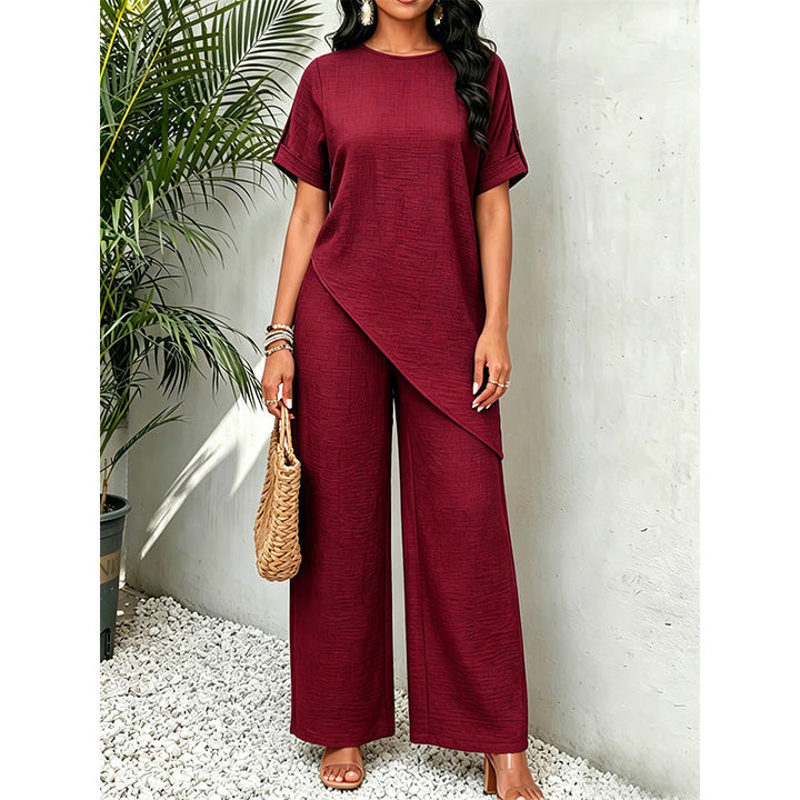 Completo coordinato donna, top asimmetrico e pantaloni ampi, un capo di moda versatile per ogni occasione.
