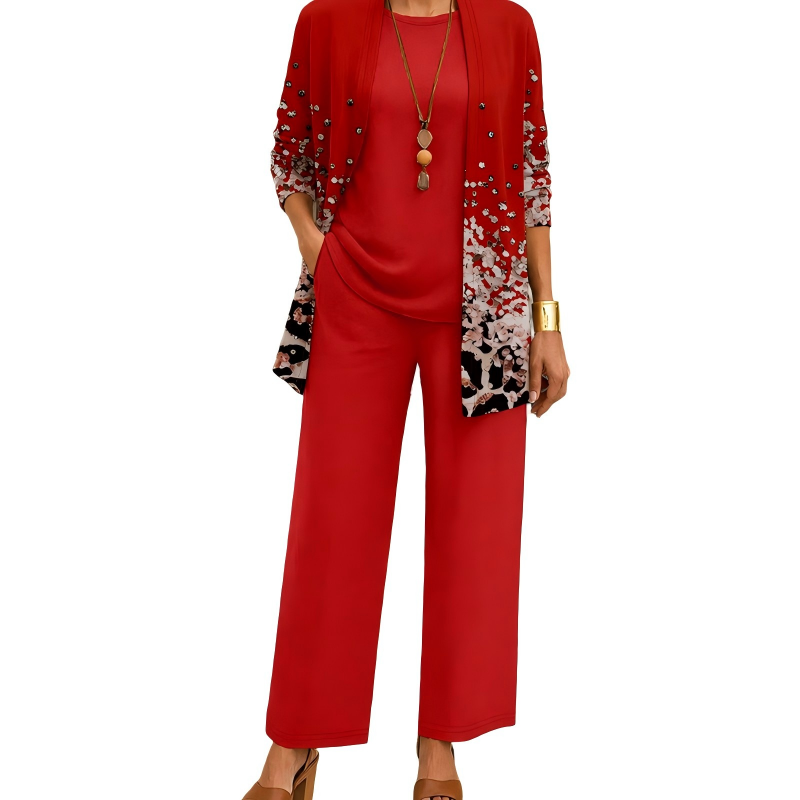 Abbigliamento donna da viaggio: completo tre pezzi con cardigan stampato, top versatile e pantaloni fluidi.