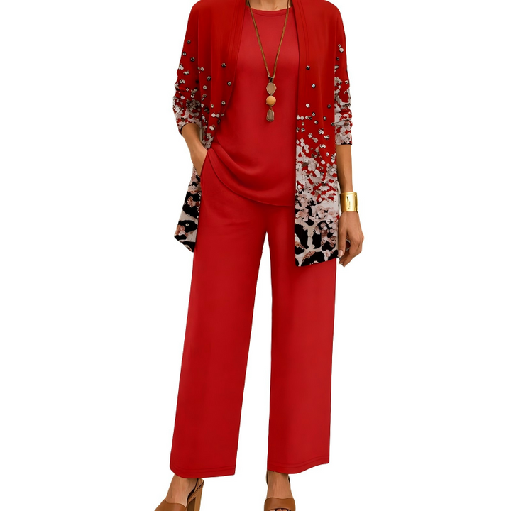 Abbigliamento donna da viaggio: completo tre pezzi con cardigan stampato, top versatile e pantaloni fluidi.