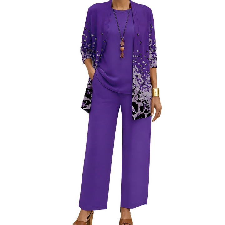 Completo donna tre pezzi con pantaloni fluidi, top e cardigan stampato. Design elegante per primavera-estate.
