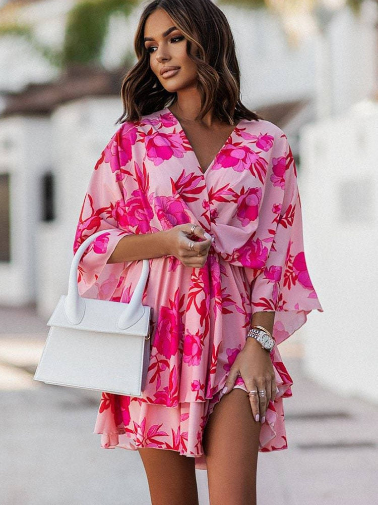 Eleganza estiva: abito donna scollo a V, linea fluida, perfetto per eventi o giornate casual.