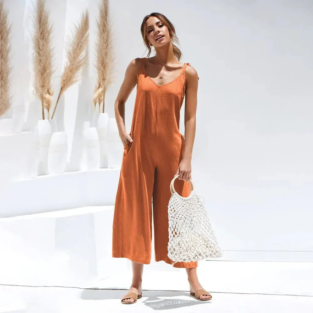 Elegante tuta midi da donna estiva, scollo a V, senza maniche. Perfetta per moda donna casual chic estiva.