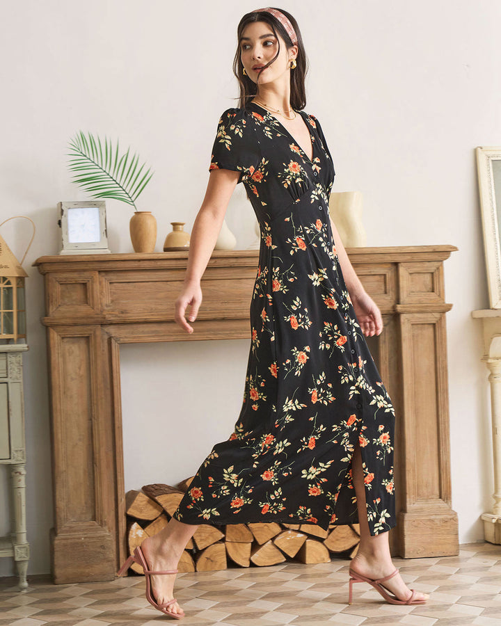 Abito lungo donna nero con stampa floreale, scollo a V e maniche corte. Perfetto per un look casual o elegante.