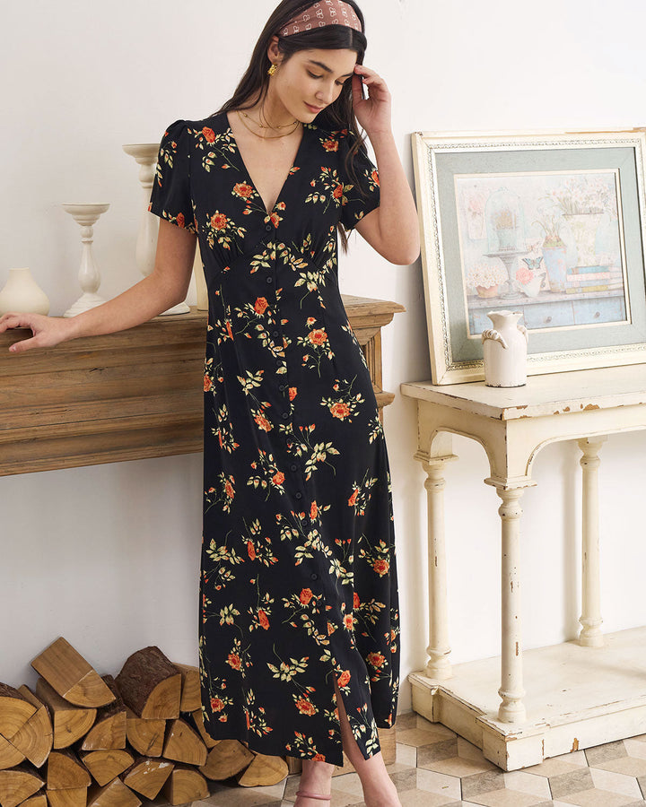 Vestito da sera maxi nero floreale, scollo a V e maniche corte. Moda primavera-estate per la donna moderna.