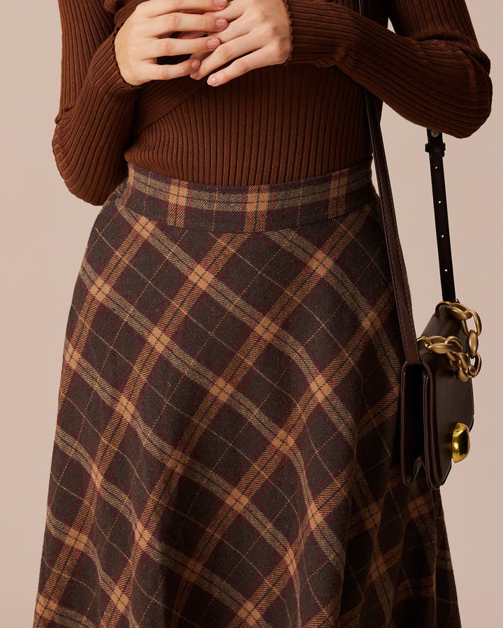 Elegante gonna midi donna marrone a quadri, vita alta con elastico. Perfetta per la moda autunno/primavera.