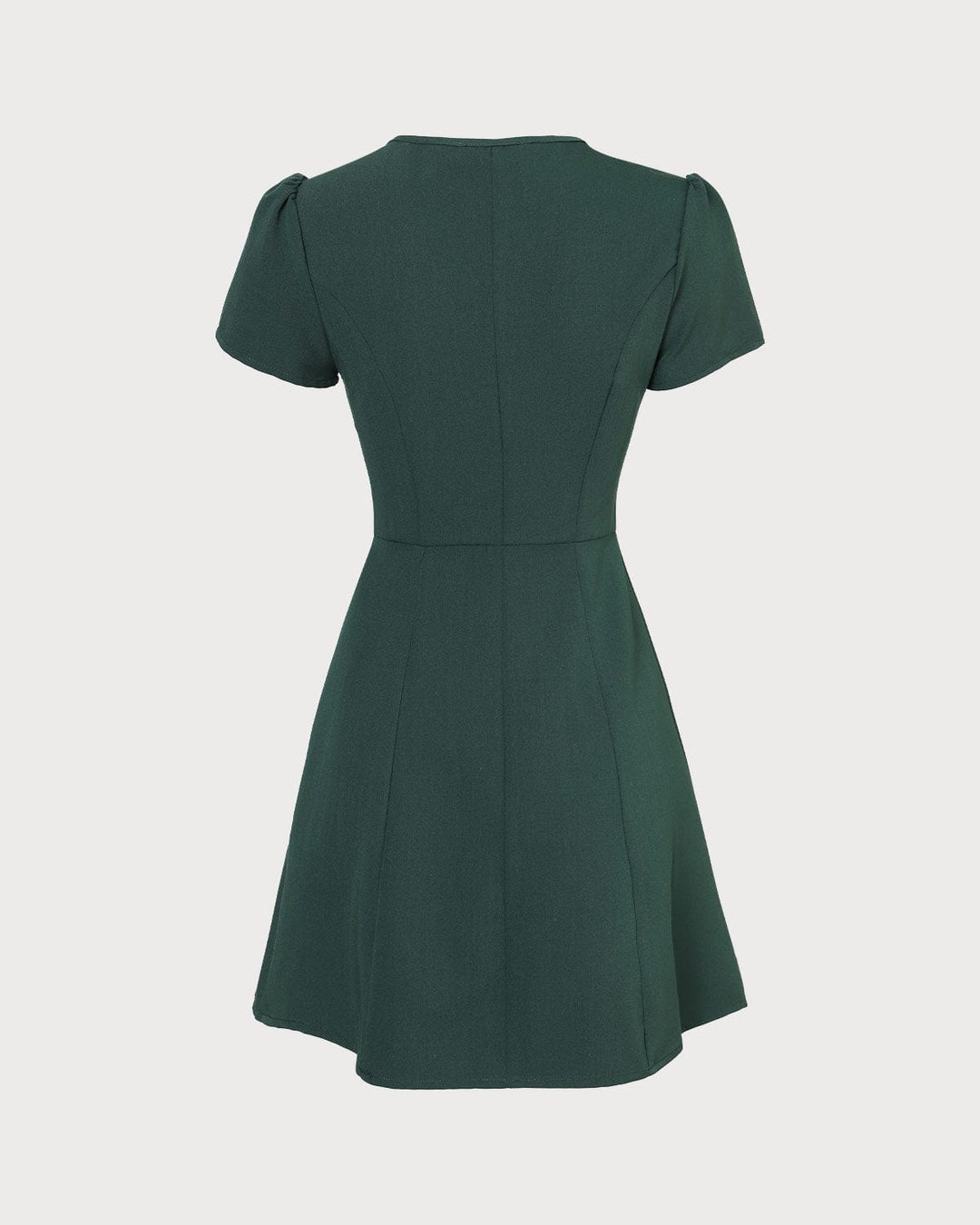Moda donna: abito mini verde scuro, scollo a V, manica corta, linea ad A. Un vestito versatile per ogni guardaroba.
