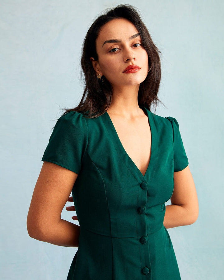 Vestito mini donna a linea ad A verde scuro, con scollo a V profondo e maniche corte, ideale per la moda estiva.