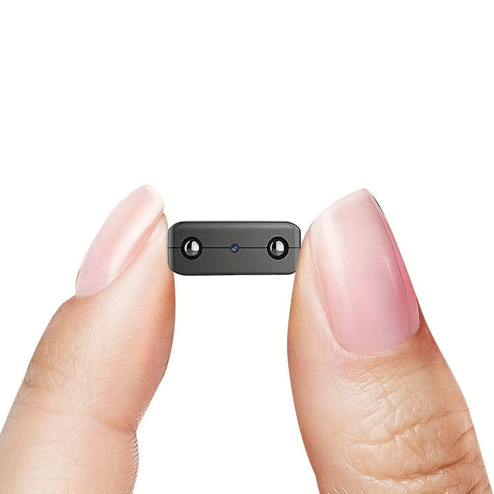 Telecamera spia portatile 1080P con rilevamento movimento e visione notturna per sicurezza domestica.