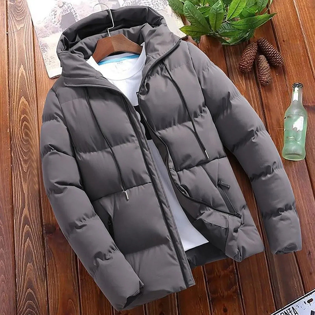 Giacca antivento trapuntata da uomo, con cappuccio per l'inverno. Piumino caldo, perfetto per abbigliamento casual.