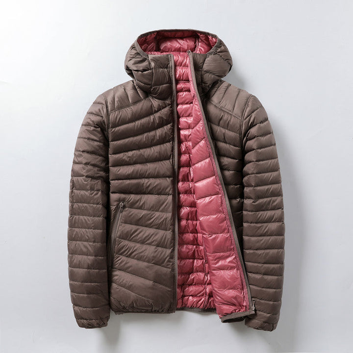 Piumino ultraleggero reversibile donna con cappuccio, giacca calda e versatile per un look casual o elegante.