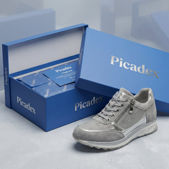 Sneakers donna casual-eleganti con zeppa alta, platform e zip, adatte a diversi stili.