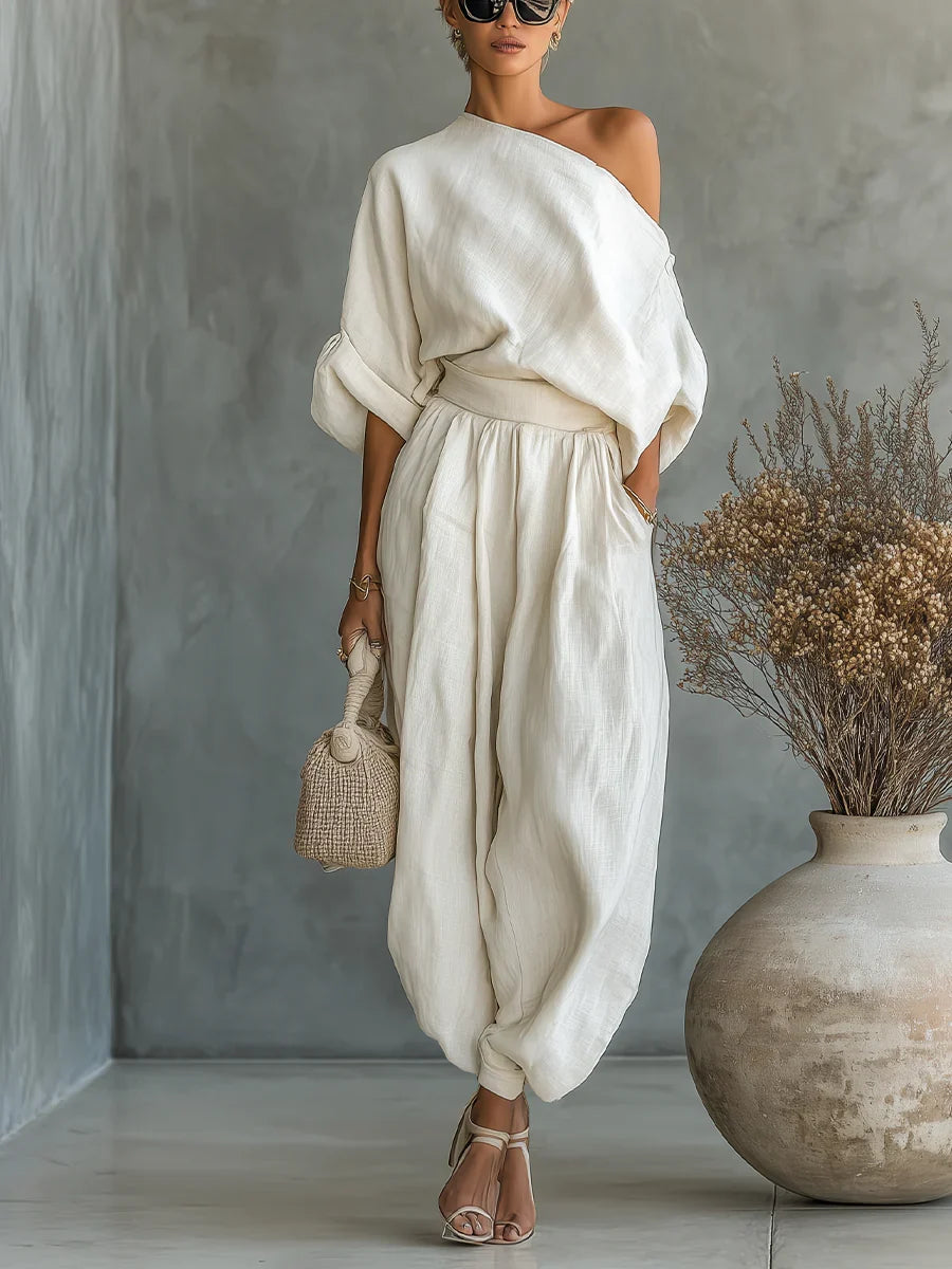 Set completo donna due pezzi bianco: top estivo spalle scoperte e pantalone largo, per un outfit versatile e alla moda.