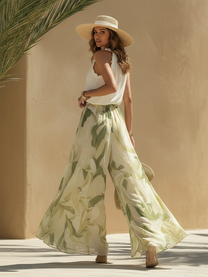Completo donna moda con top a V e pantaloni palazzo a vita elasticizzata, stampa floreale multicolore.