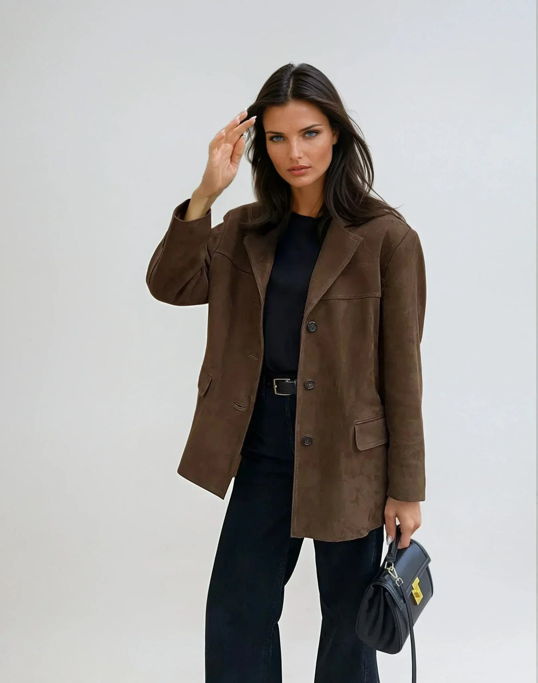 Blazer donna marrone elegante con tasche, perfetto per l'ufficio e outfit chic di moda femminile.