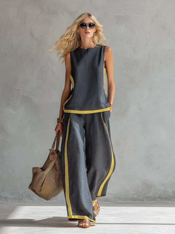 Pantaloni donna gamba larga, parte del set coordinato con pannelli a contrasto, stile casual-chic.