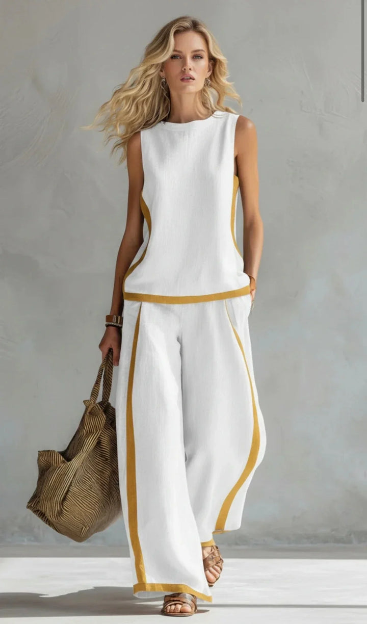 Set casual donna primaverile con pantaloni gamba larga e top coordinato, pannelli a contrasto trendy.