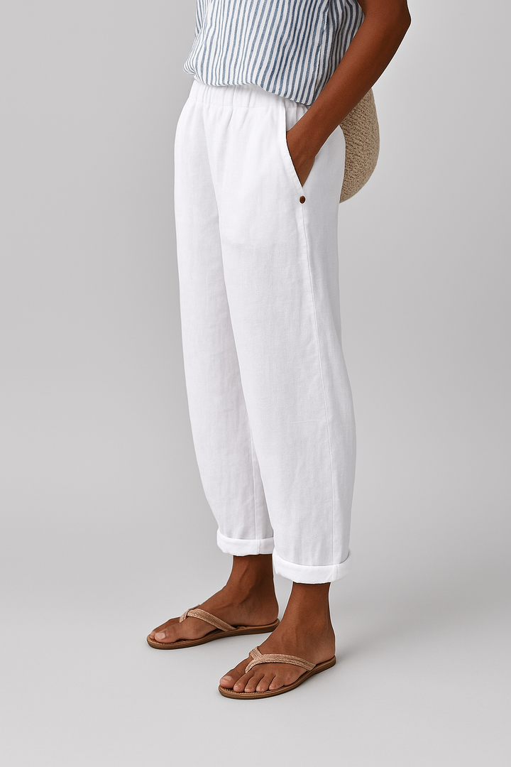 Pantaloni dritti da donna con vita elastica. Dettagli bottoni laterali. Comodi, versatili e ideali per l'estate.