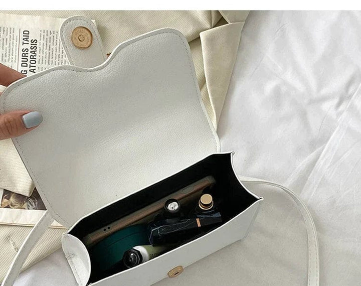 Borsa a mano donna compatta, con portamonete integrato. Design funzionale e alla moda per ogni occasione.