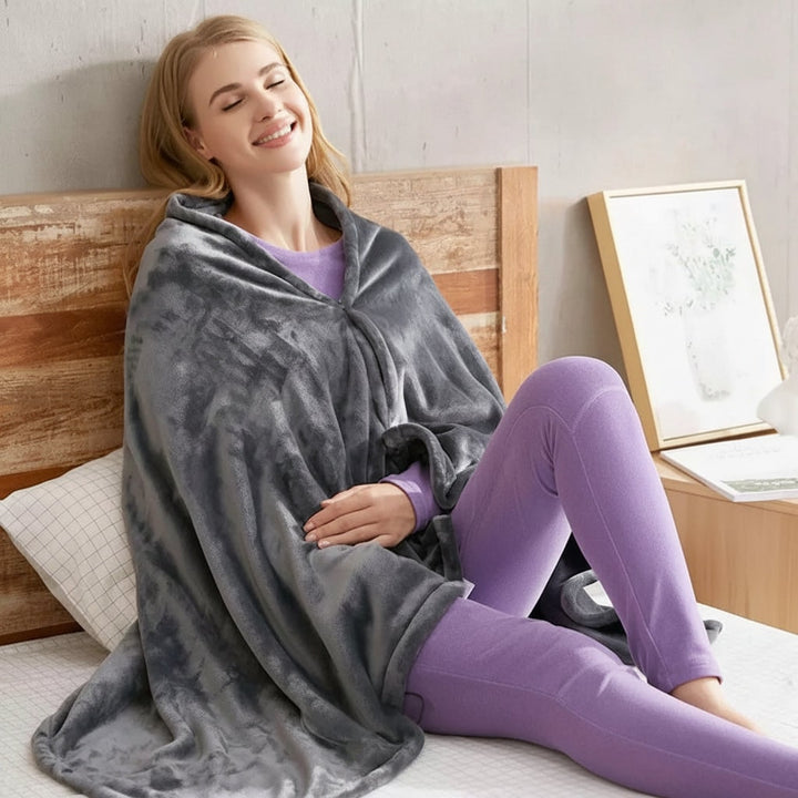 Coperta riscaldata indossabile unisex con cerniera, garantisce comfort e calore regolabile per inverno.