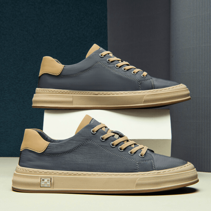 Scarpe da uomo basse leggere, ideali per chi cerca traspirabilità e supporto ammortizzato, stile casual sportivo.