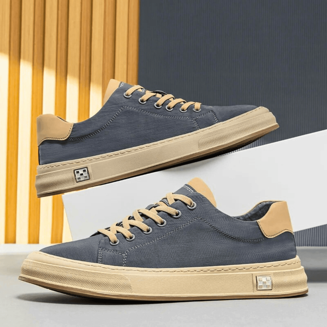 Sneakers da uomo nere e grigie, design moderno e leggero per massimo comfort durante tutto il giorno.