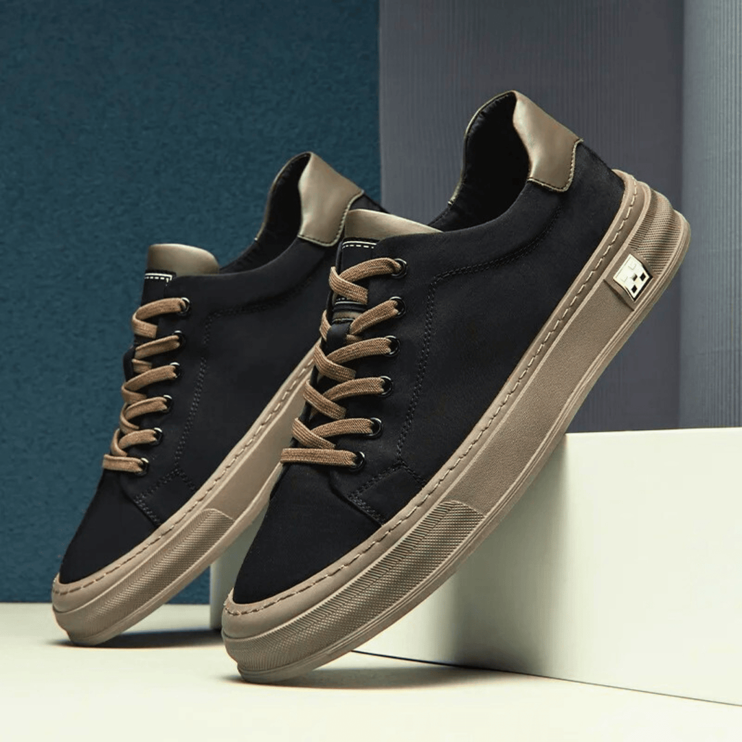 Sneakers da uomo grigio e nero, versatili e comode, ideali per uno stile casual sportivo e dinamico.