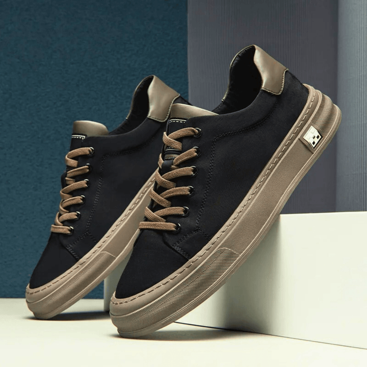Sneakers da uomo grigio e nero, versatili e comode, ideali per uno stile casual sportivo e dinamico.