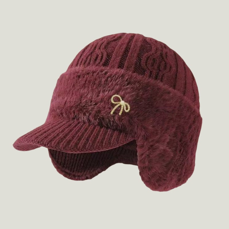 Accessorio unisex: cappello invernale in maglia con visiera e paraorecchie, stile confortevole.