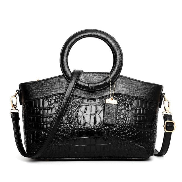 Borsa elegante donna in ecopelle con pattern coccodrillo, chiusura lampo dorata.