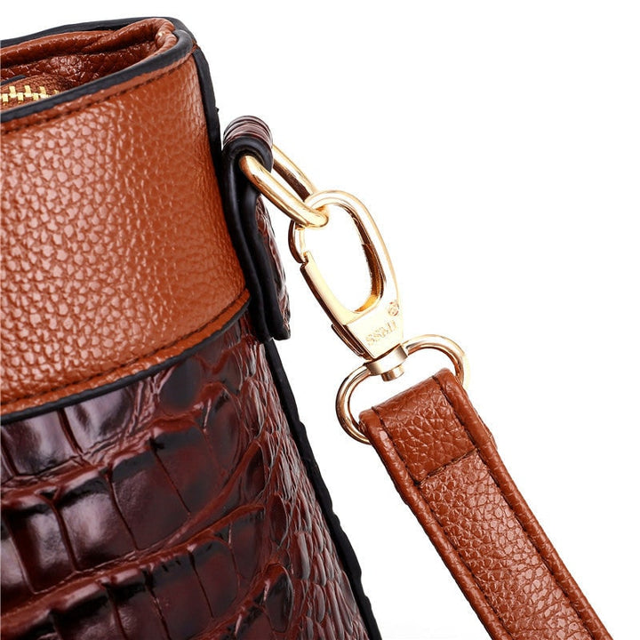 Borsa donna moda: stampa coccodrillo, design sofisticato, dettagli dorati brillanti.