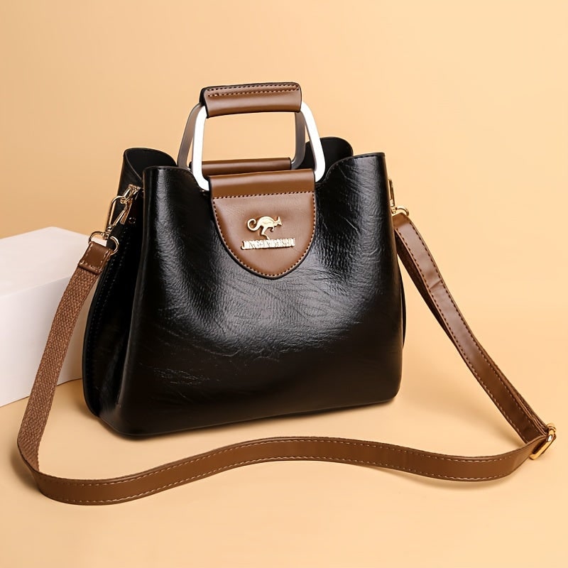 Elegante borsa a tracolla da donna in ecopelle marrone testurizzata, perfetta per il look quotidiano.