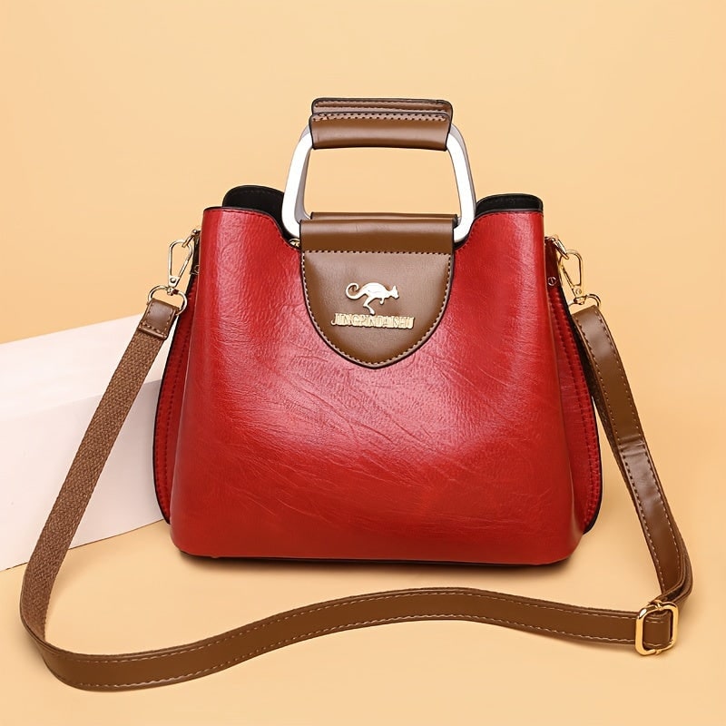 Accessorio moda: borsa a tracolla da donna in ecopelle testurizzata, design elegante e pratico per la vita quotidiana.